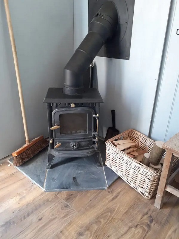 The log burner will keep you warm & cosy. We'll provide you with a starter pack of logs and starter sticks, and if you need more we sell bags at a nominal fee.
