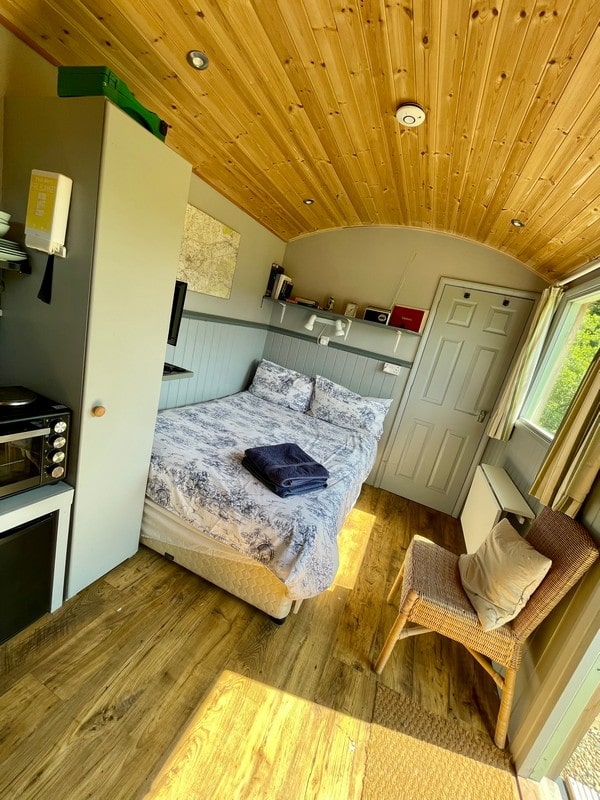 Inside the Shepherds Hut with a double bed